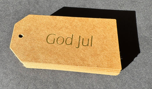 God Jul tag guld text på kraftpapper
