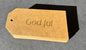 God Jul tag guld text på kraftpapper